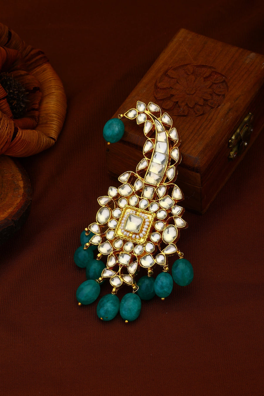White Jadau Kundan Kalgi With Green Hangings